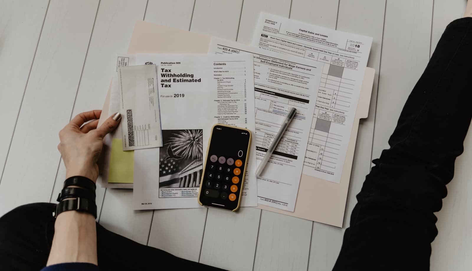 Loan paperwork and a fountain pen on a desk