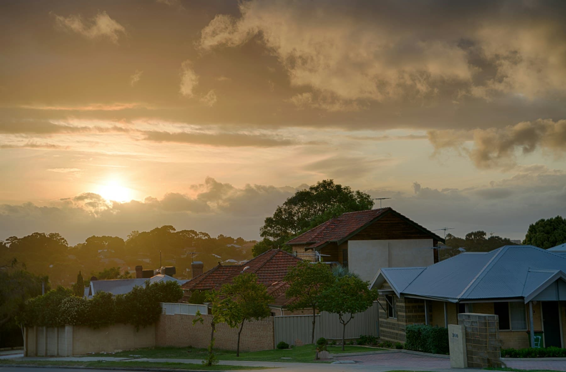 Quiet Australian suburban street at sunset.