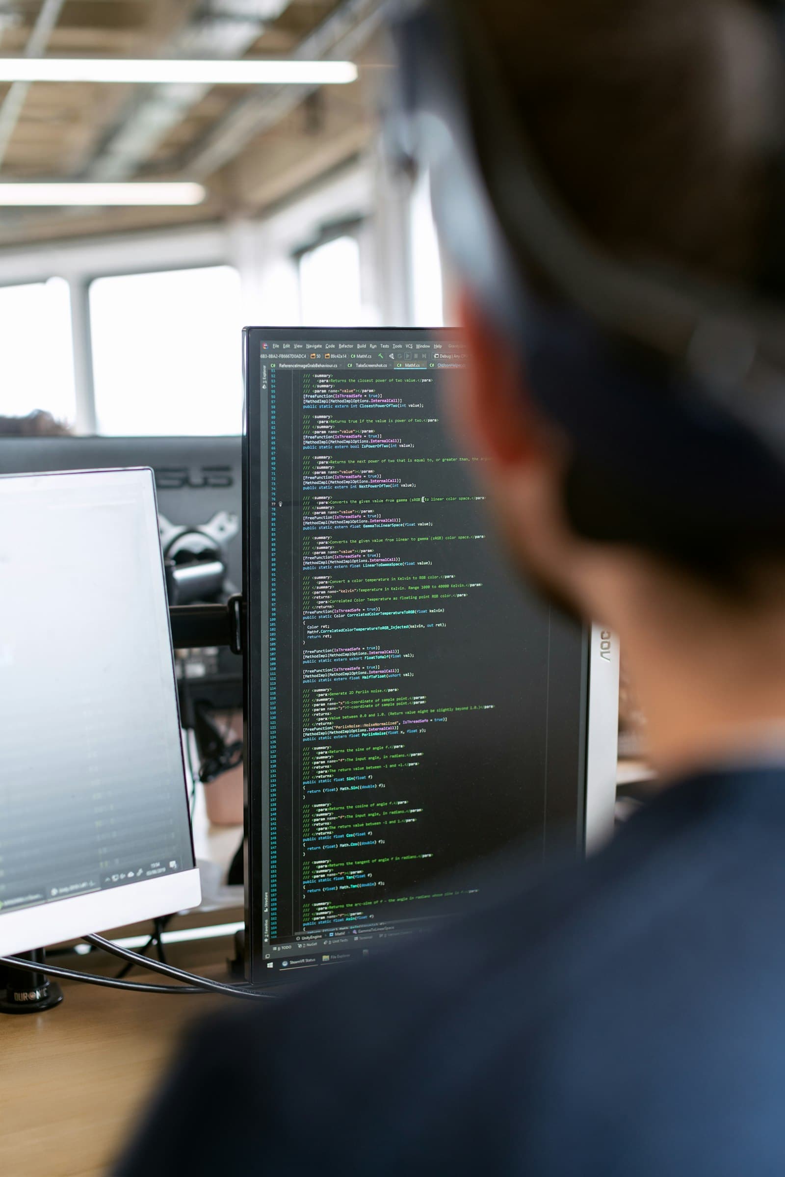 A sole trader reviewing business paperwork at a desk.