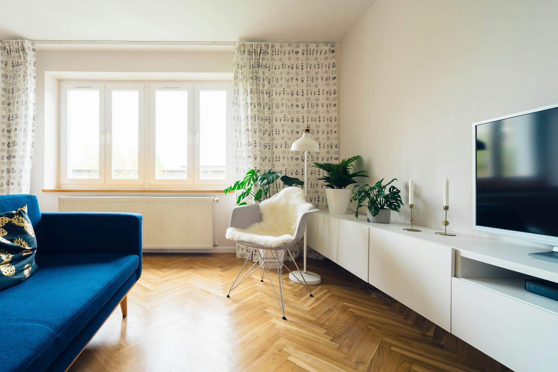 A first home buyer at the door of a new home.