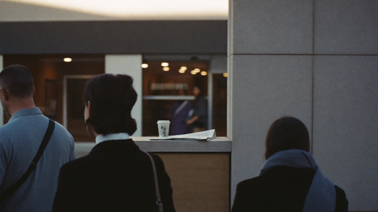 Commuters passing a bank branch in a Sydney laneway on a winter morning at the start of the new financial year.